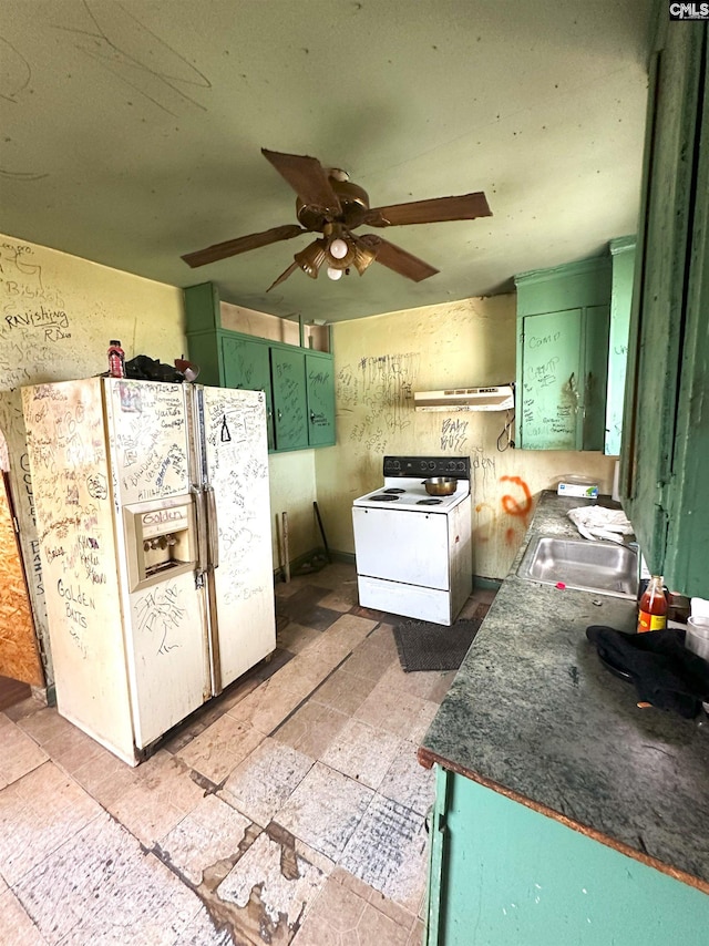 kitchen with sink, white appliances, ceiling fan, and green cabinets