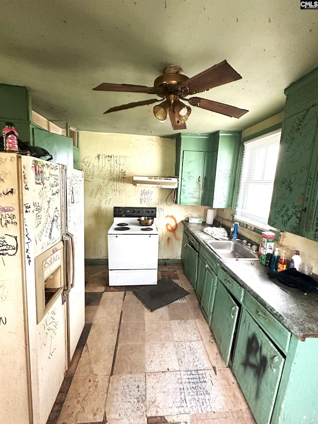 kitchen with sink, white appliances, ceiling fan, and green cabinets