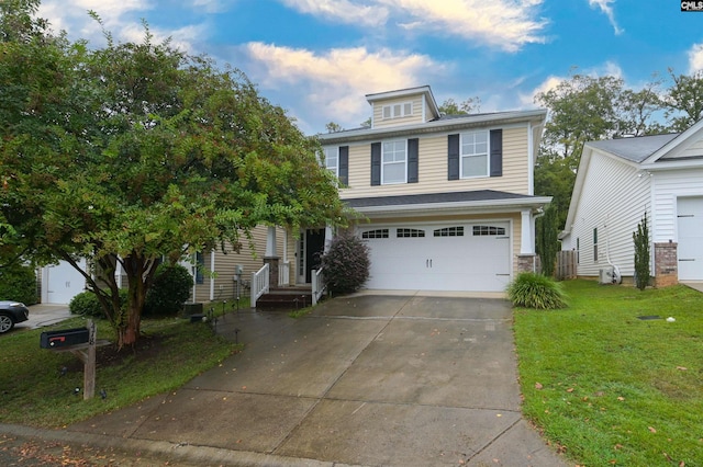 view of front of property featuring a garage and a front yard