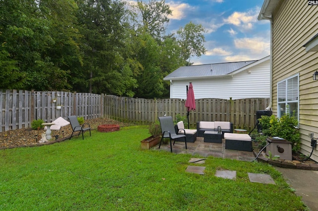 view of yard with outdoor lounge area and a patio