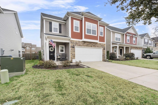 townhome / multi-family property featuring a garage and a front yard