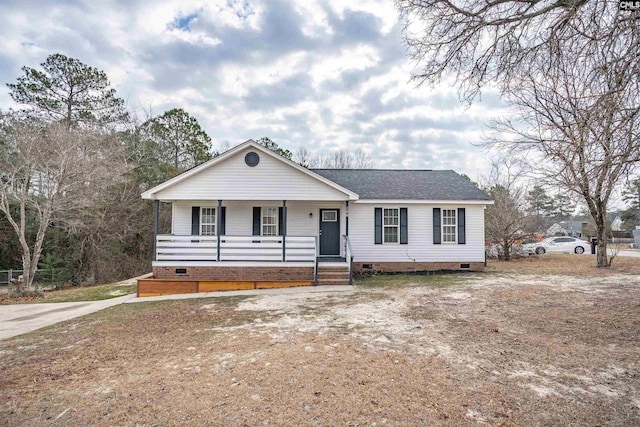 single story home featuring covered porch