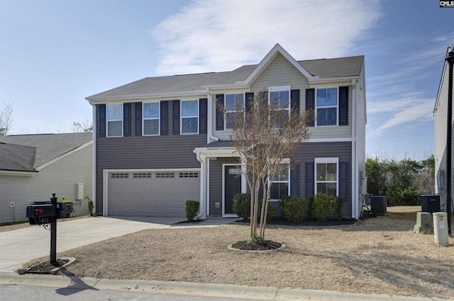 colonial home with a garage and central AC unit