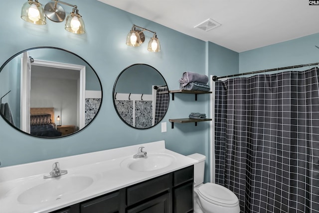 bathroom with a shower with curtain, vanity, and toilet