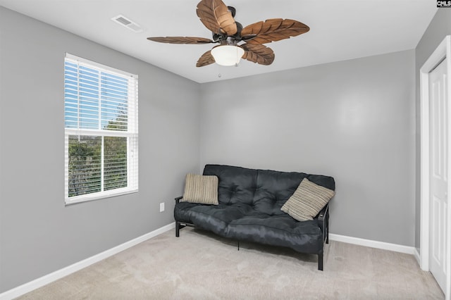 sitting room with light carpet and ceiling fan