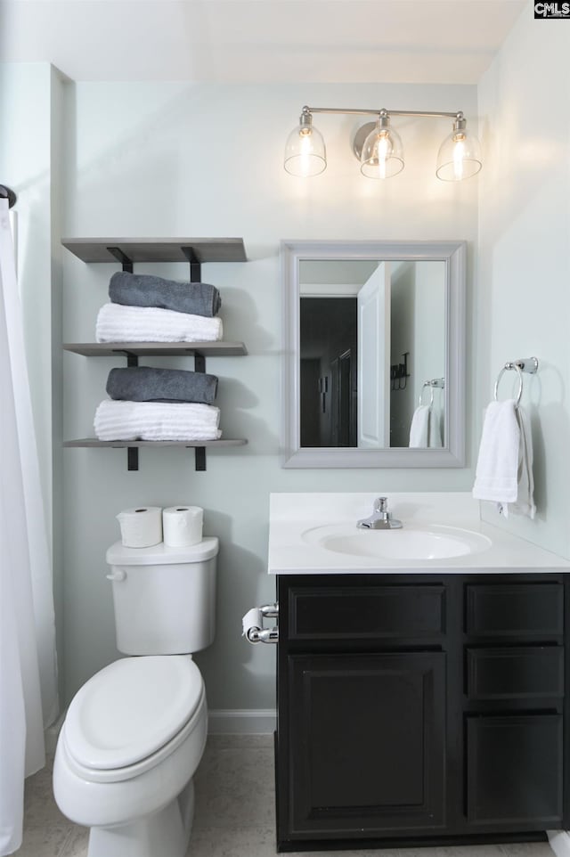 bathroom with vanity and toilet