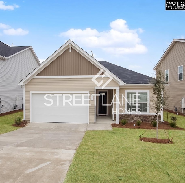 view of front of home with a garage, driveway, and a front yard