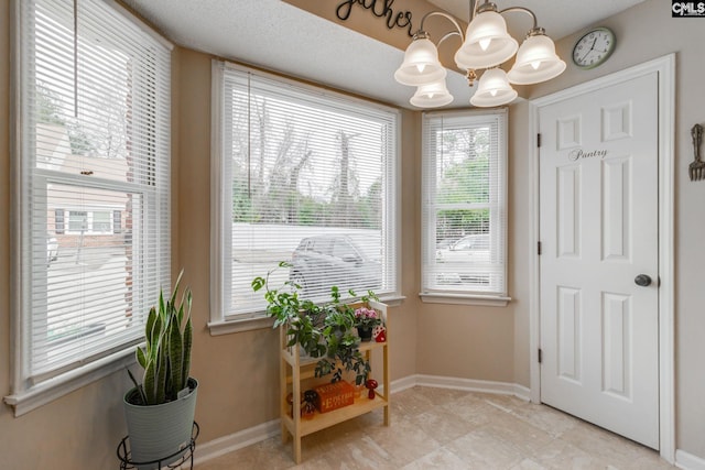 living area featuring a notable chandelier