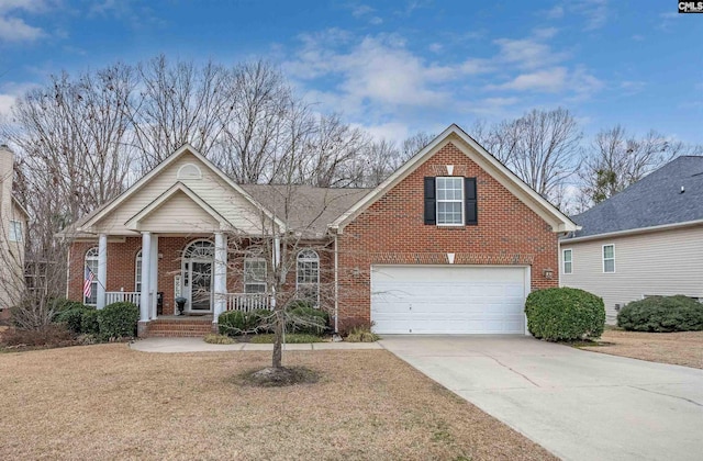 front facade with a garage, a front lawn, and covered porch