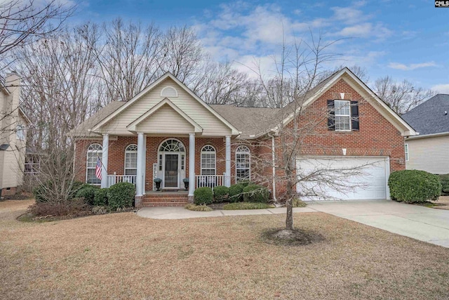 view of front of home with a garage, a front lawn, and a porch