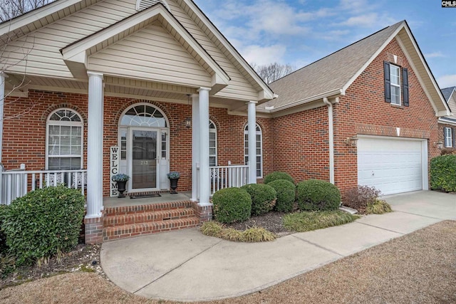 view of front facade featuring a porch and a garage