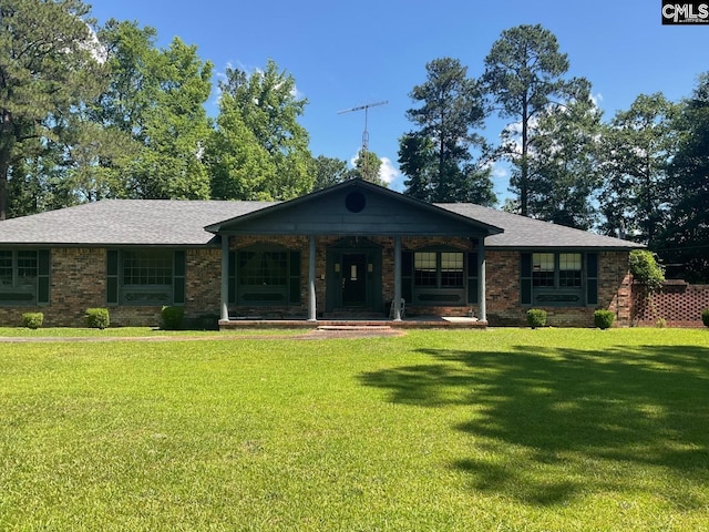 ranch-style home featuring a front yard