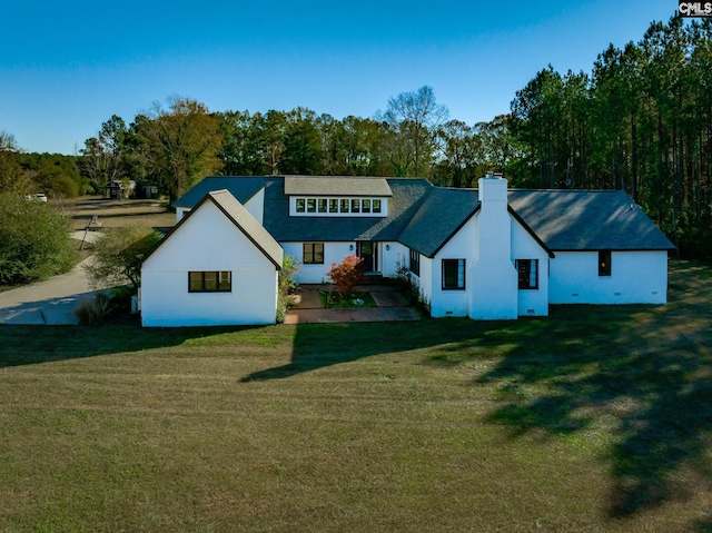 back of house with a yard