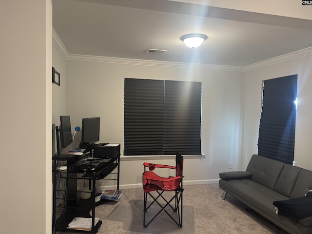 carpeted office space featuring crown molding