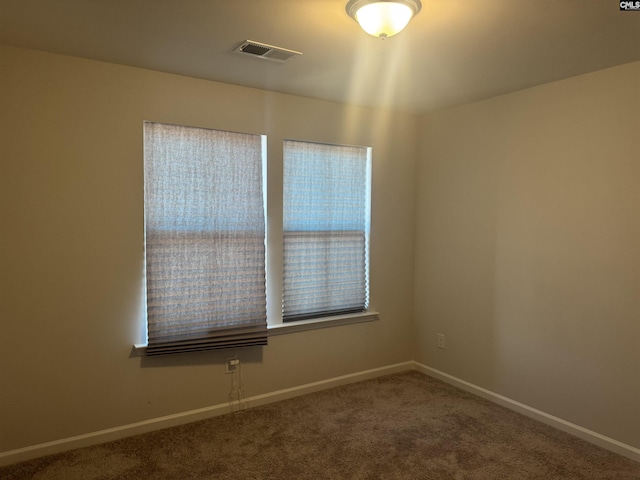 unfurnished room with carpet floors