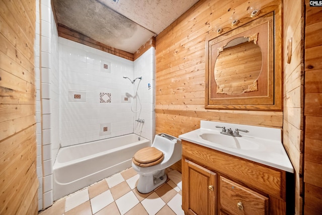 104 Brandon Rd, Clinton, SC 29325 - full bathroom with toilet, wood walls, tiled shower / bath, a textured ceiling, and vanity