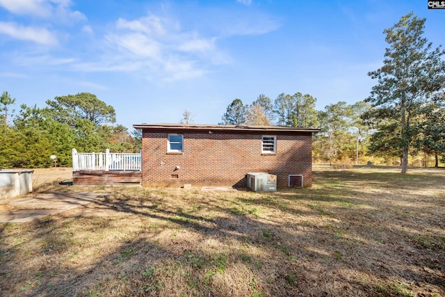 104 Brandon Rd, Clinton, SC 29325 - rear view of property featuring a yard, central AC unit, and a deck