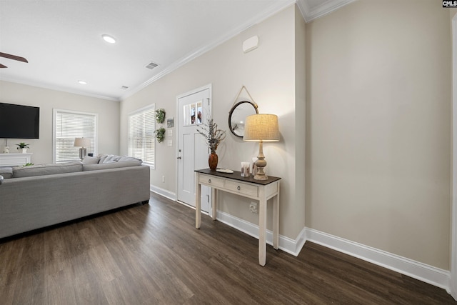 living room featuring dark wood-type flooring, ornamental molding, and ceiling fan