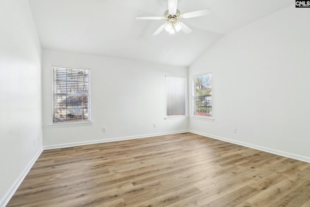 unfurnished room featuring ceiling fan, lofted ceiling, and light hardwood / wood-style floors