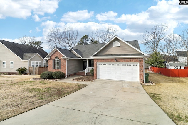 view of front of house with a garage and a front lawn