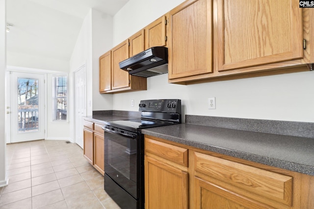 kitchen featuring light tile patterned flooring, lofted ceiling, and black electric range