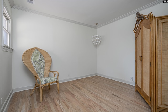 unfurnished room with ornamental molding and light hardwood / wood-style floors