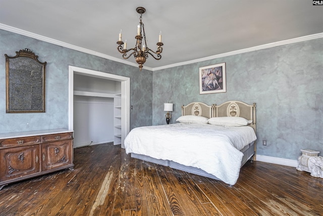 bedroom with an inviting chandelier, dark wood-type flooring, ornamental molding, and a closet