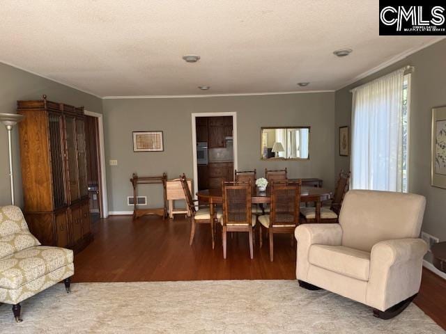 interior space featuring crown molding and dark hardwood / wood-style flooring