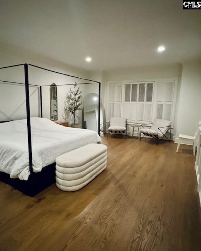 bedroom featuring hardwood / wood-style flooring