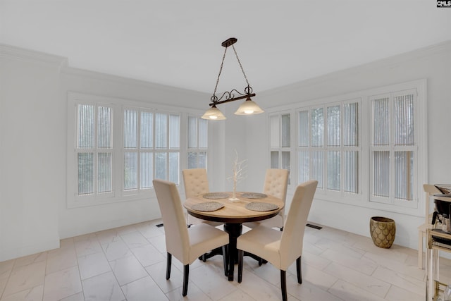 dining room with crown molding