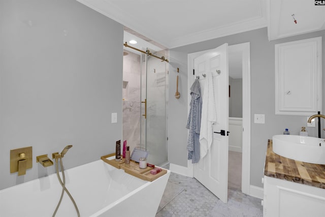 bathroom with vanity, crown molding, and separate shower and tub