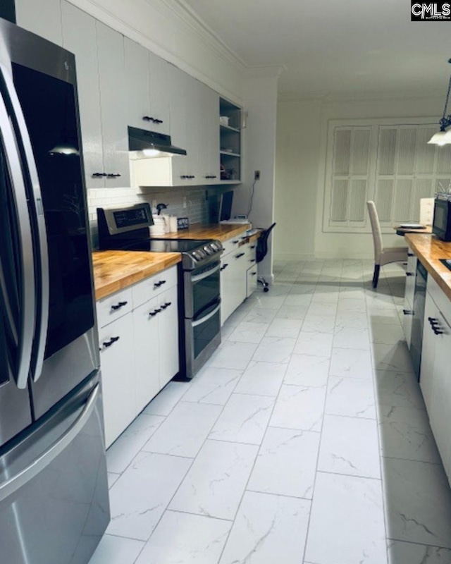 kitchen with white cabinetry, appliances with stainless steel finishes, wooden counters, and pendant lighting