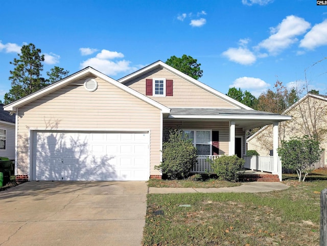 view of front facade featuring a garage and covered porch