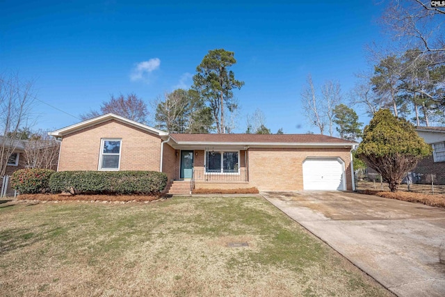 single story home featuring a garage and a front lawn