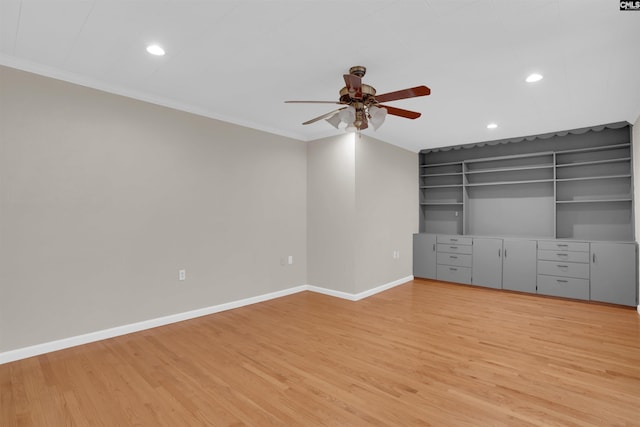 unfurnished bedroom featuring light hardwood / wood-style flooring, ornamental molding, and ceiling fan