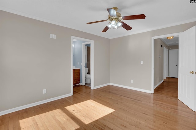 unfurnished room with ornamental molding, ceiling fan, and light wood-type flooring