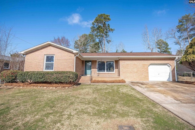 single story home featuring a garage and a front lawn