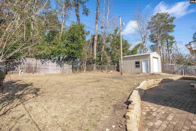 view of yard featuring an outdoor structure and a patio