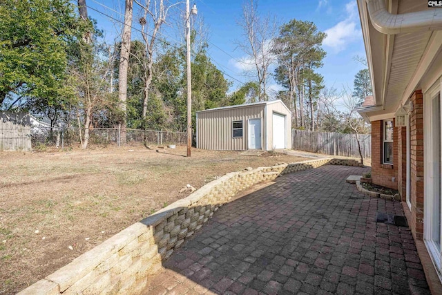 view of yard with a storage shed and a patio