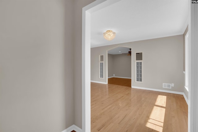 empty room featuring hardwood / wood-style floors and ceiling fan