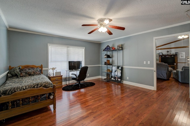 bedroom with hardwood / wood-style floors, crown molding, a textured ceiling, and ceiling fan