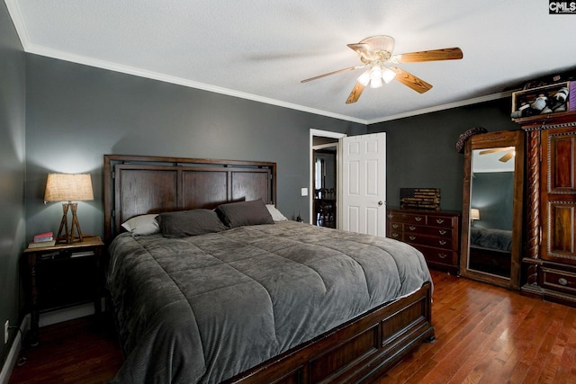 bedroom with crown molding, ceiling fan, and dark hardwood / wood-style flooring