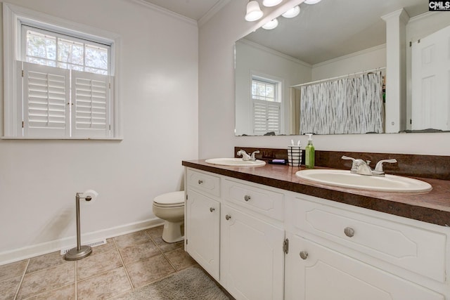 bathroom with crown molding, vanity, toilet, and tile patterned flooring