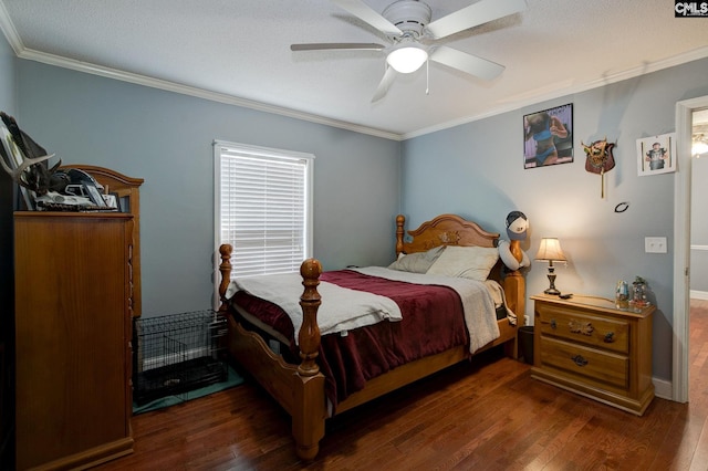 bedroom with ornamental molding, dark hardwood / wood-style floors, and ceiling fan