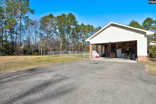 garage featuring a lawn