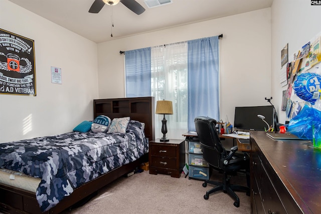 bedroom featuring light colored carpet and ceiling fan