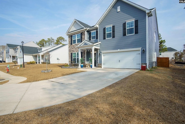 view of front of property featuring a garage and a front lawn