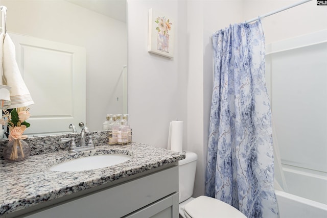 full bathroom featuring vanity, shower / bath combination with curtain, and toilet