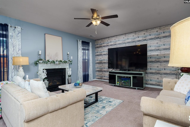 carpeted living room with ceiling fan