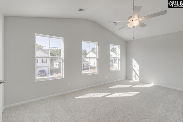 unfurnished room with lofted ceiling, light carpet, and ceiling fan